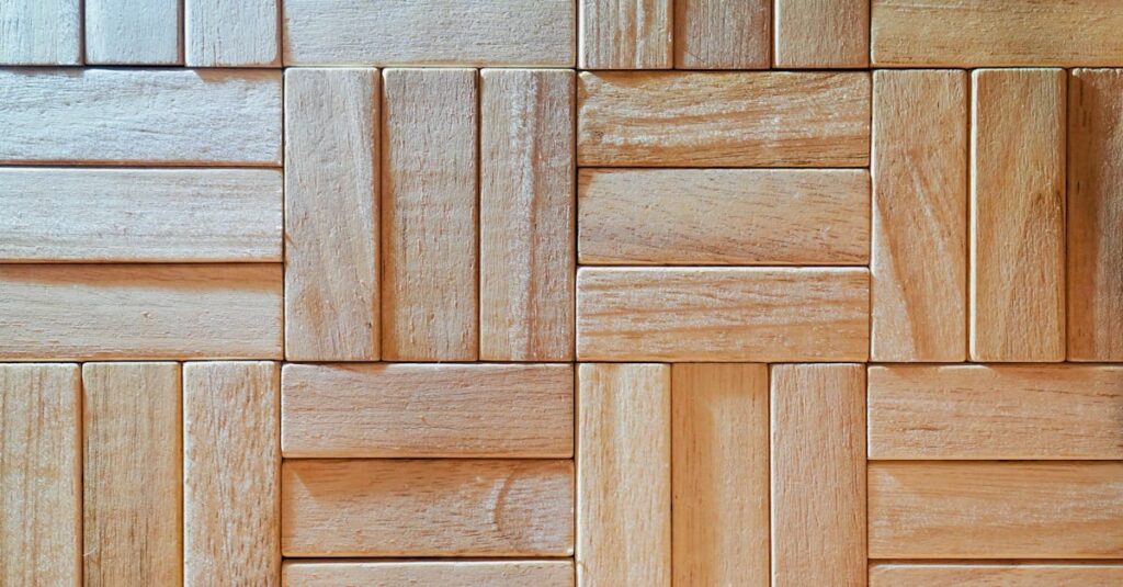 ニトリの木目調ジョイント防音マットをリビングに設置した写真。トランポリンの下にぴったり敷かれている