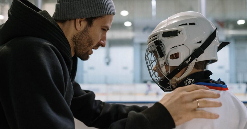 子どもに笑顔で声かけするトランポリンの先生